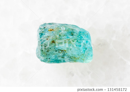 raw starlite blue zircon mineral on white marble 131458172