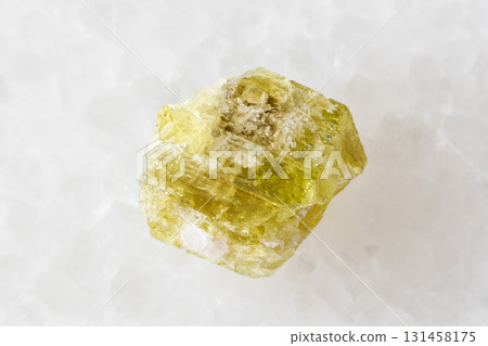 sample of raw chrysoberyl mineral on white marble sample of raw chrysoberyl mineral on white marble 131458175