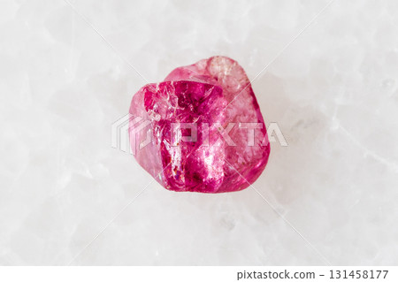 sample of rough pink spinel mineral on white sample of rough pink spinel mineral on white 131458177