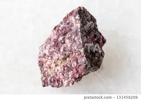 sample of rough piemontite mineral on white 131458209