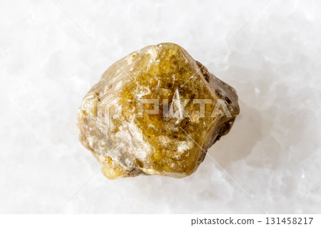 rough single grossular garnet crystal on white 131458217