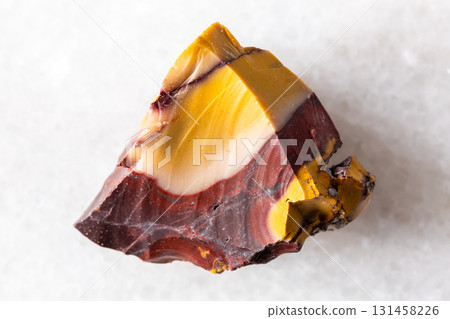 sample of raw colorful mookaite mineral on white 131458226