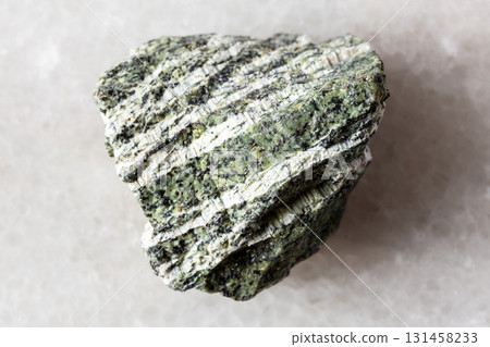 sample of raw chrysotile serpentine rock on white sample of raw chrysotile serpentine rock on white 131458233