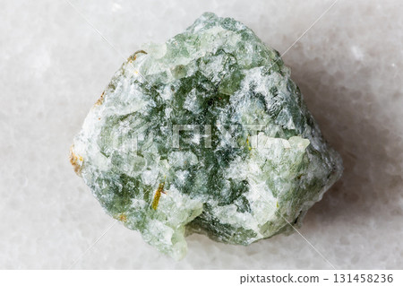 sample of uncut green aventurine mineral on white 131458236