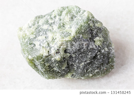 sample of raw green nephrite mineral on white 131458245