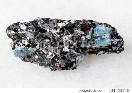 sample of raw kyanite in biotite rock on white sample of raw kyanite in biotite rock on white 131458246