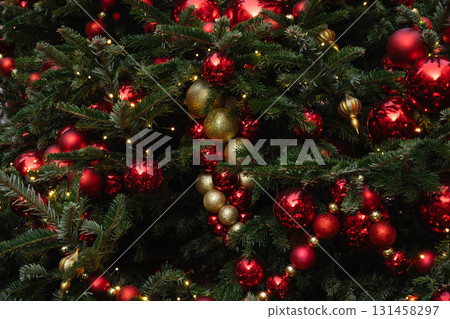 Details decorated Christmas tree with red ball, garland. Xmas card. Close up. Winter. Outdoor. Details decorated Christmas tree with red ball, garland. Xmas card. Close up. Winter. Outdoor. 131458297