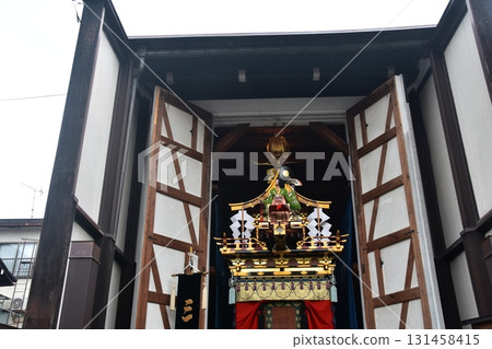 Takayama City, Gifu Prefecture, Japan: During the spring Takayama Festival, gorgeous floats called yatai are displayed inside the storehouse during rainy weather. Takayama City, Gifu Prefecture, Japan: During the spring Takayama Festival, gorgeous floats called yatai are displayed inside the storehouse during rainy weather. 131458415