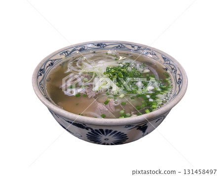 Delicious Vietnamese pho noodle soup with beef and fresh herbs in traditional bowl 131458497