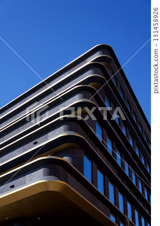 Masarycka office and retail building by Zaha Hadid Architects with golden facade on March 5, 2025 in Prague, Czech Republic. Masarycka office and retail building by Zaha Hadid Architects with golden facade on March 5, 2025 in Prague, Czech Republic. 131458926