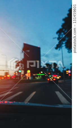 Twilight driving on city highway, blurred tail lights. Road safe, vertical 131459601