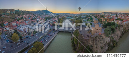Tbilisi panorama with Kura river and Metekhi church at sunset 131459777
