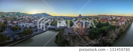 Tbilisi panorama with Kura river and Metekhi church at sunset Tbilisi panorama with Kura river and Metekhi church at sunset 131459780