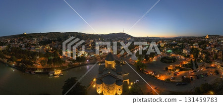 Tbilisi skyline at dusk with Kura river and city lights 131459783