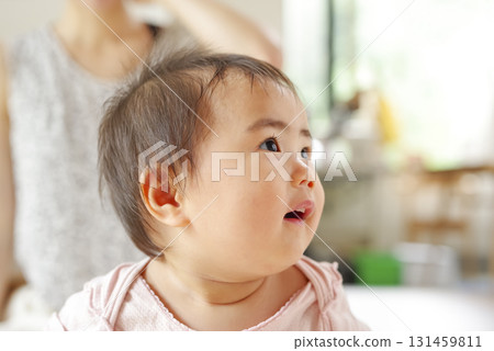 Baby's adorable profile and facial expression Baby's adorable profile and facial expression 131459811