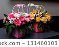Floral gift arrangements in pink and peach decorative boxes 131460103