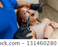 Dentist holding anesthesia syringe before dental procedure 131460280