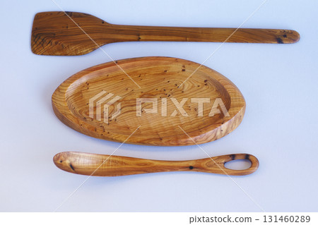 Wooden kitchen utensils stacked view close up isolated 131460289