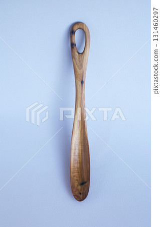 Wooden kitchen utensils stacked view close up isolated Wooden kitchen utensils stacked view close up isolated 131460297