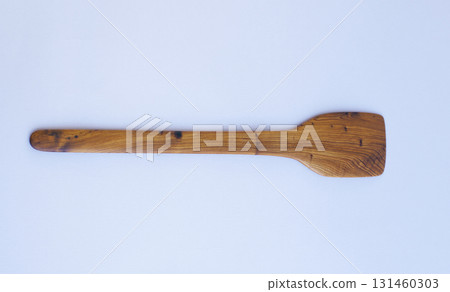 Wooden kitchen utensils stacked view close up isolated Wooden kitchen utensils stacked view close up isolated 131460303