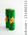 Natural wax candles with bay leaf and dried orange for rituals and space cleansing 131460313