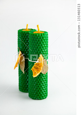 Natural wax candles with bay leaf and dried orange for rituals and space cleansing Natural wax candles with bay leaf and dried orange for rituals and space cleansing 131460313