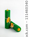 Natural wax candles with bay leaf and dried orange for rituals and space cleansing 131460340
