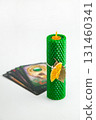 Natural wax candles with bay leaf and dried orange for cleansing rituals and wishes 131460341