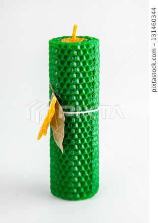 Natural wax candles with bay leaf and dried orange for rituals and space cleansing 131460344