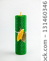 Natural wax candles with bay leaf and dried orange for rituals and space cleansing 131460346