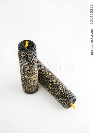 Unique decorative candles with a textured surface for home decor 131460358