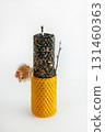 Bee-inspired beeswax ritual candle for wealth and protection with herbs and burdock 131460363