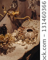 Decorative sink filled with shells and natural elements in a cozy bathroom setting 131460366