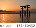 The large torii gate of Shirahige Shrine standing in Lake Biwa at dawn 131460432