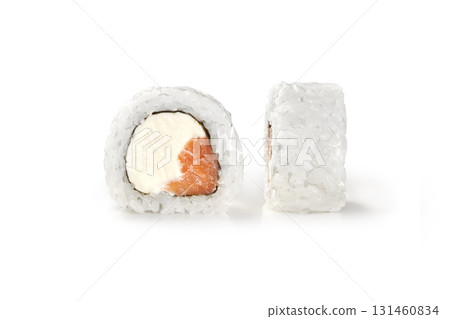 Philadelphia uramaki sushi roll showing salmon and cream cheese filling on white background 131460834