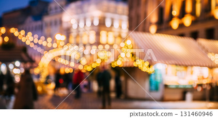 Abstract Blurred Bokeh Boke Background Of Traditional Christmas Market In Night European Town. Evening Street Decorated With Festive Christmas Xmas New Year Illuminations 131460946