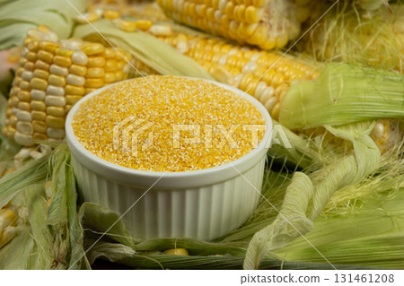 Corn Grits in Ceramic Bowl and Fresh Sweet Corn Corn Grits in Ceramic Bowl and Fresh Sweet Corn 131461208