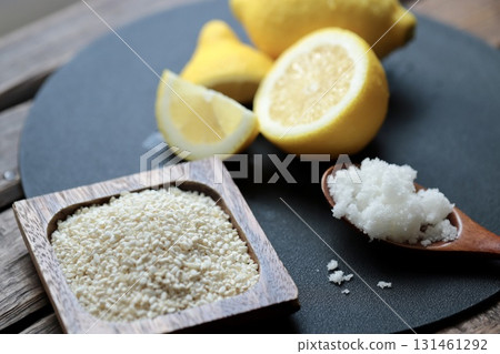 Ingredients for lemon koji before mixing: rice koji, coarse salt, and unwaxed lemon Ingredients for lemon koji before mixing: rice koji, coarse salt, and unwaxed lemon 131461292