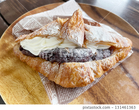 Cream-filled croissant, crispy pastry dessert 131461363