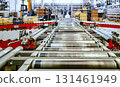 logistic warehouse. packing line in a logistics warehouse. conveyor belt in a modern production line 131461949