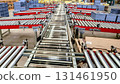 logistic warehouse. packing line in a logistics warehouse. conveyor belt in a modern production line 131461950