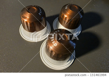 Espresso coffee capsules brown and white Espresso coffee capsules brown and white 131461994