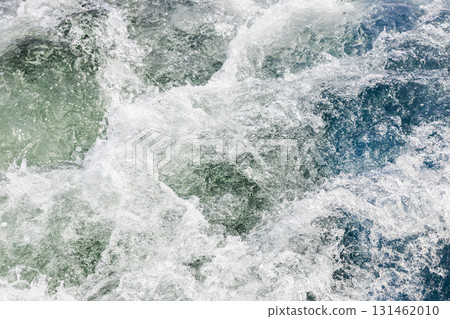 water churned up by propeller behind boat 131462010