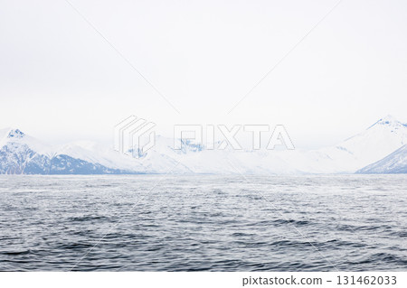 snowy shore of Pacific ocean in Avacha in spring snowy shore of Pacific ocean in Avacha in spring 131462033