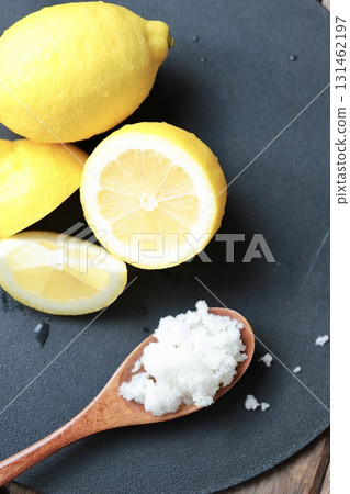 Ingredients for salted lemon before mixing: coarse salt and unwaxed lemon 131462197