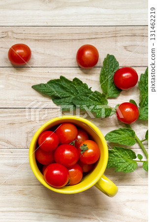 cherry tomatoes on wooden table background cherry tomatoes on wooden table background 131462219