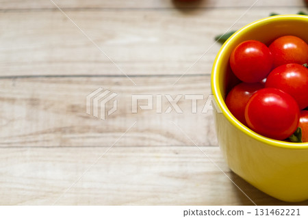cherry tomatoes on wooden table background cherry tomatoes on wooden table background 131462221