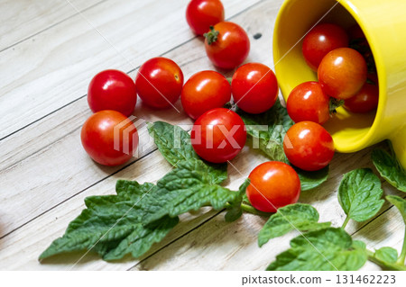 cherry tomatoes on wooden table background 131462223