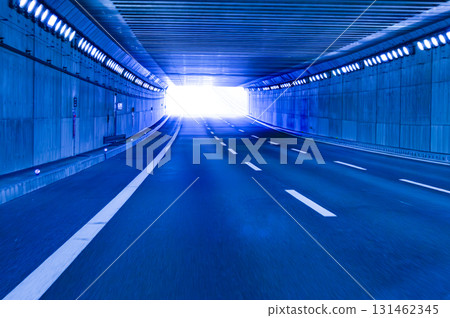 Cyber tunnel illuminated with blue light and exit light Cyber tunnel illuminated with blue light and exit light 131462345