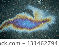 Oil slick on pavement forming colorful iridescent patterns, symbolizing pollution and environmental impact 131462794